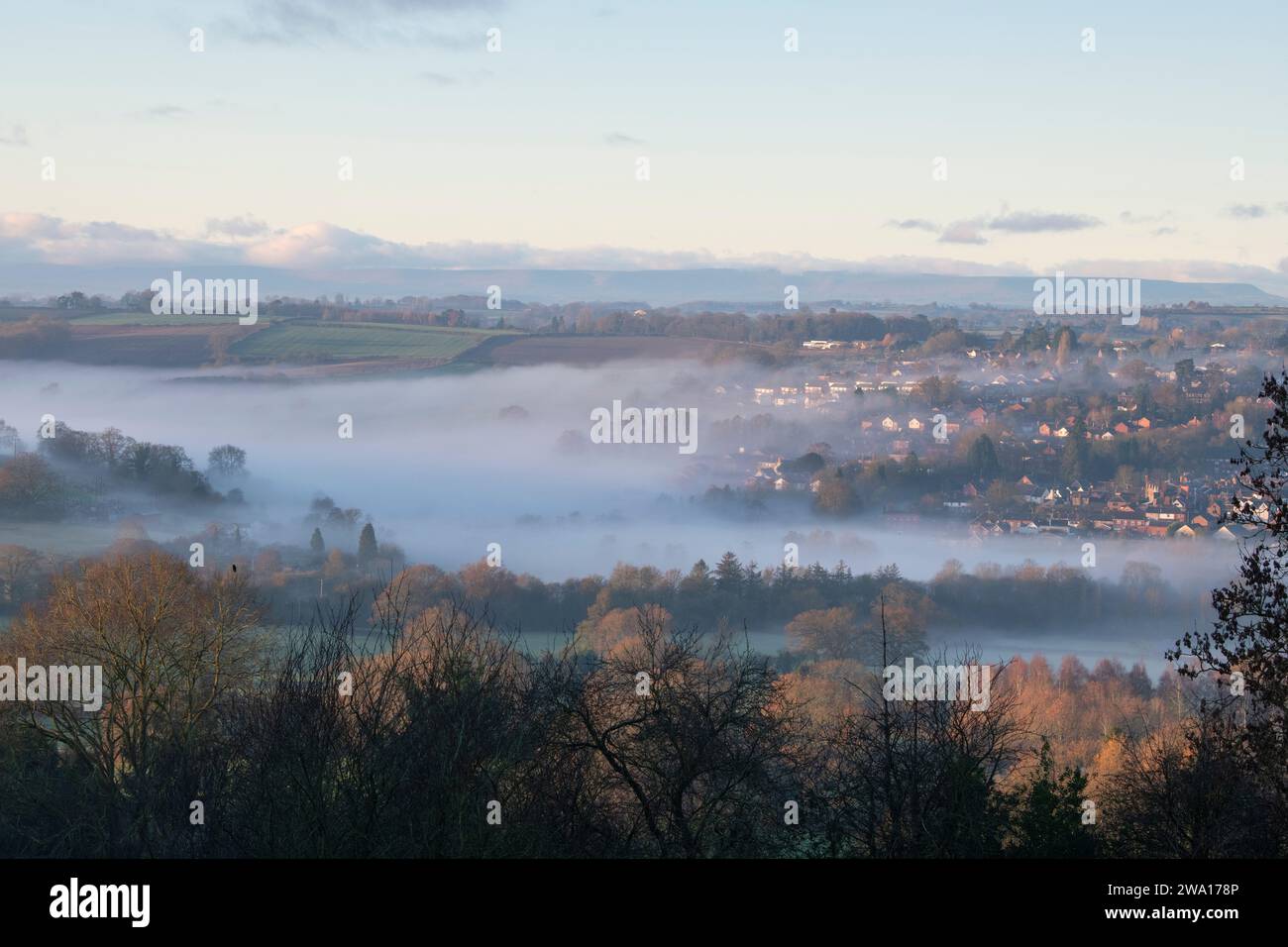 Looking over Bromyard from Bromyard Downs in the morning mist and sunlight. Bromyard, Herefordshire, England Stock Photo
