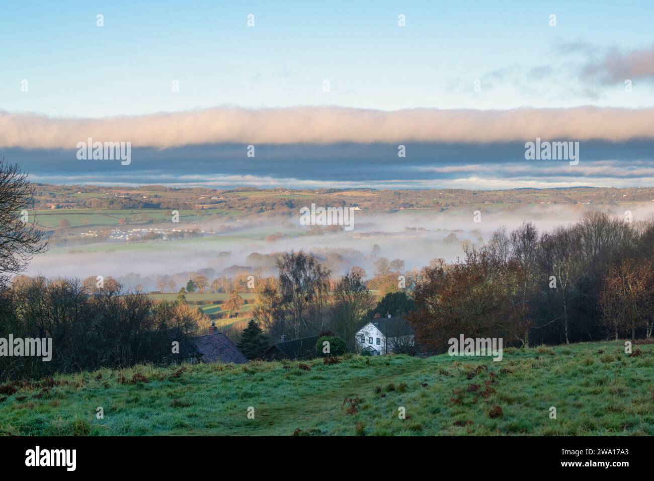 Looking over Bromyard from Bromyard Downs in the morning mist and sunlight. Bromyard, Herefordshire, England Stock Photo