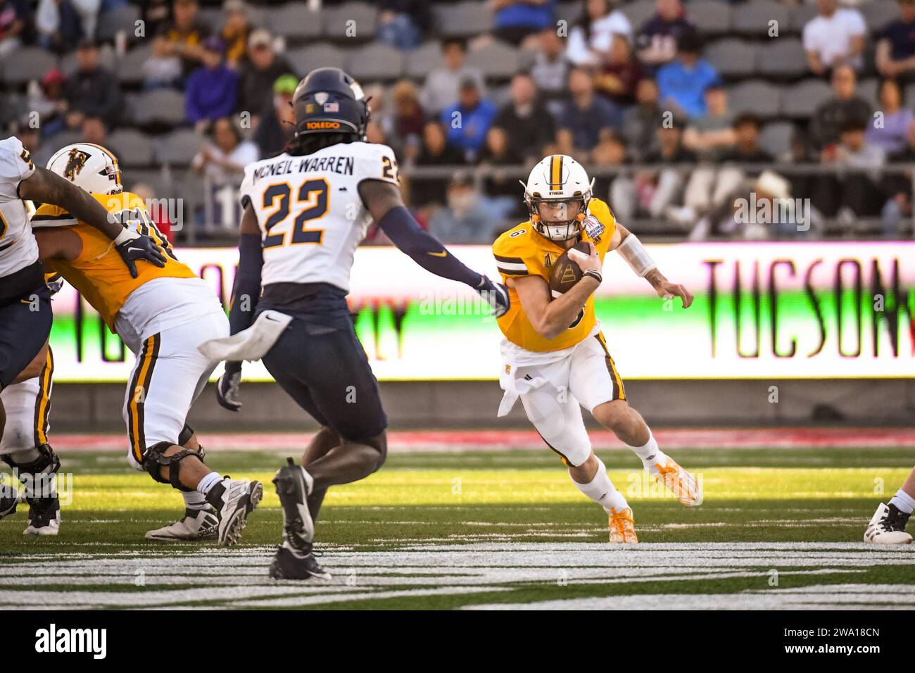 Wyoming Cowboys quarterback Andrew Peasley (6) runs for a first down in ...