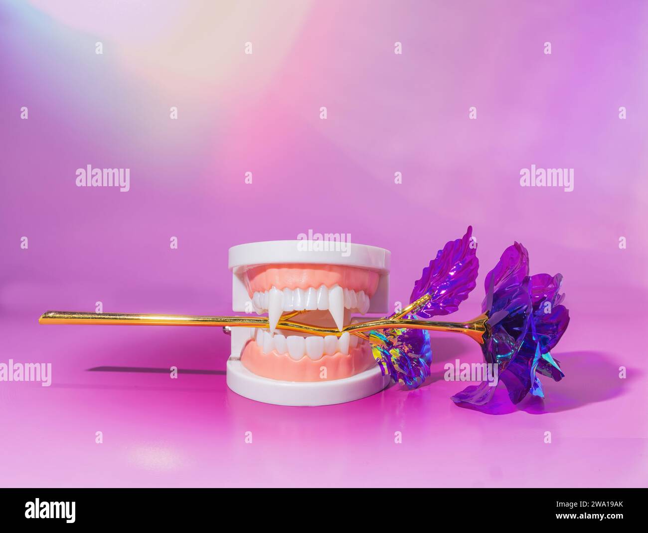 A Vampire Mouth Holding a Purple Holographic Rose Flower on a Pastel