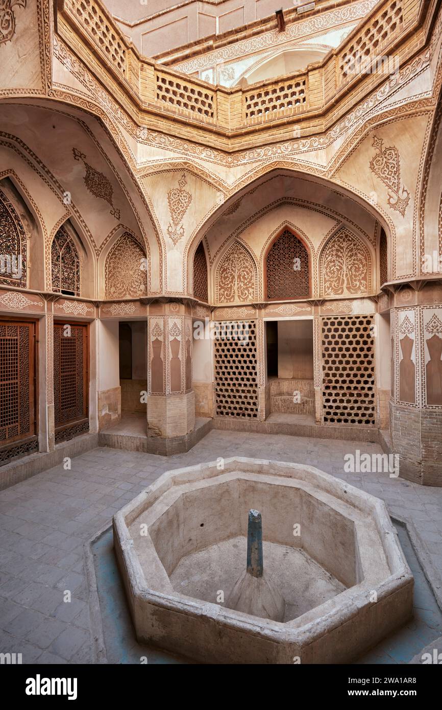 Small courtyard with dry fountain basin in the Abbasi House, traditional rich Persian house built in 1823. Kashan, Iran. Stock Photo