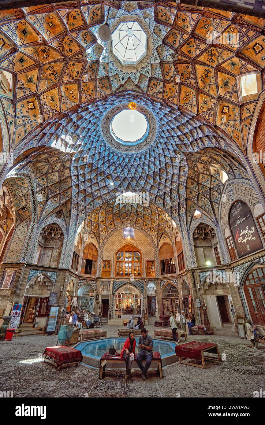 Domed ceiling with intricate geometric patterns in the Aminoddole Caravanserai, historic structure in the Grand Bazaar of Kashan, Iran. Stock Photo