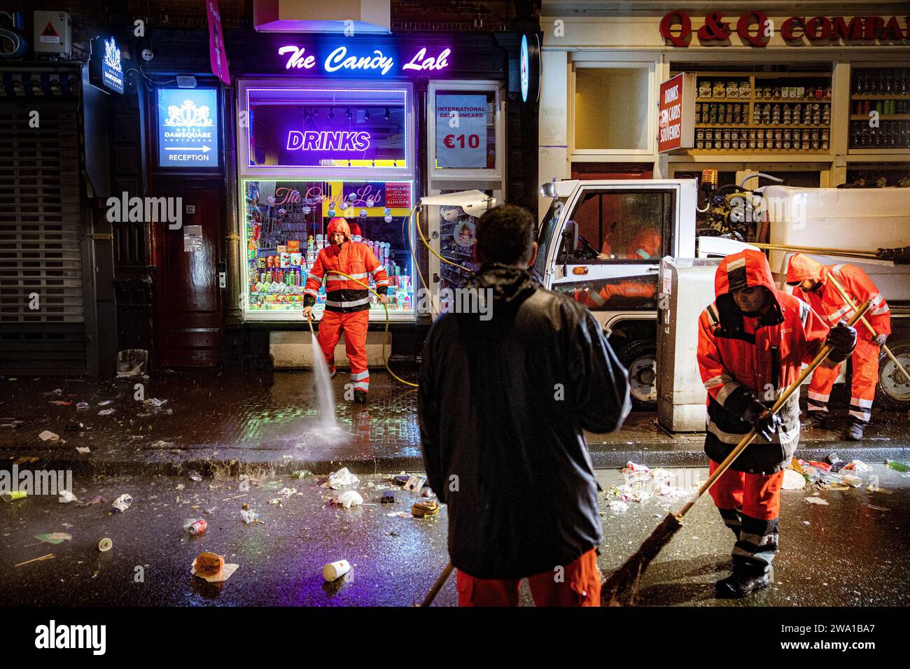 AMSTERDAM New Year's Eve mess on Damstraat in Amsterdam. Cleaning