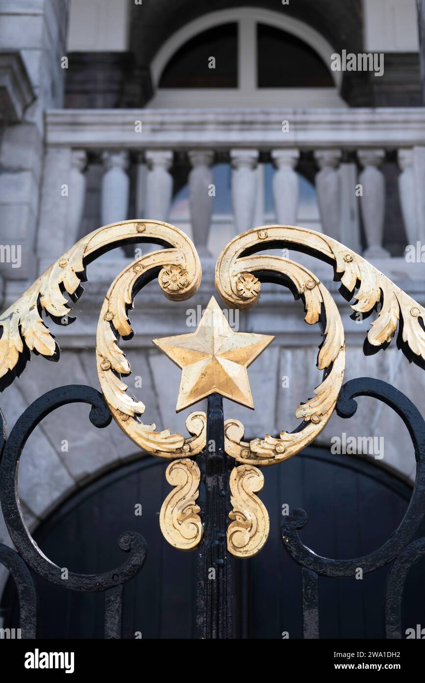Beautiful gilded decorated black cast iron gate in front of the entrance to the town hall on the Markt in the center of Maastricht, the Netherlands Stock Photo