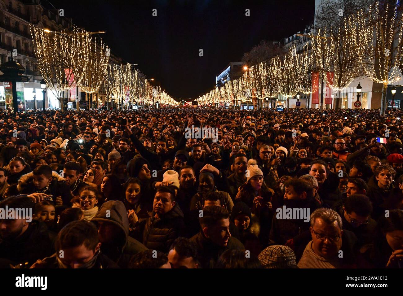 Paris, France. 01st Jan, 2024. Celebrators gather for the New Year's