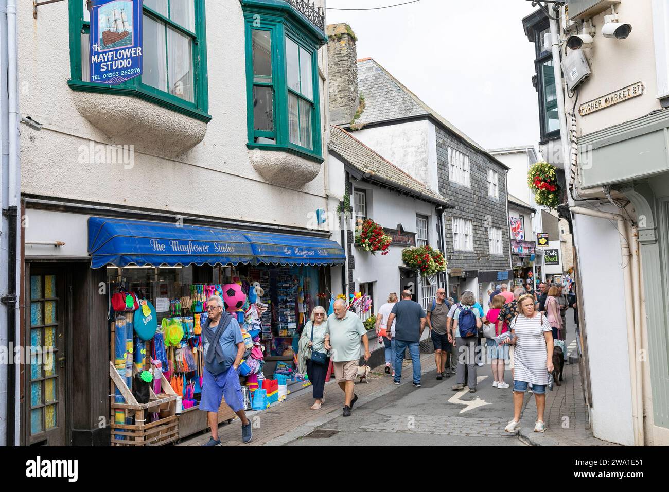 Looe Cornwall, Looe town centre and tourists walk the narrow shopping streets and laneways, hot autumn day,England,UK,2023 Stock Photo