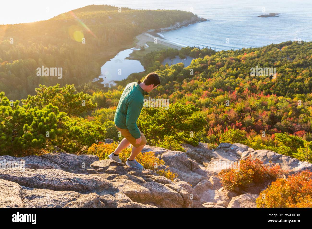 Man hiking along Beehive Trail, Acadia National Park, Maine, USA Stock Photo