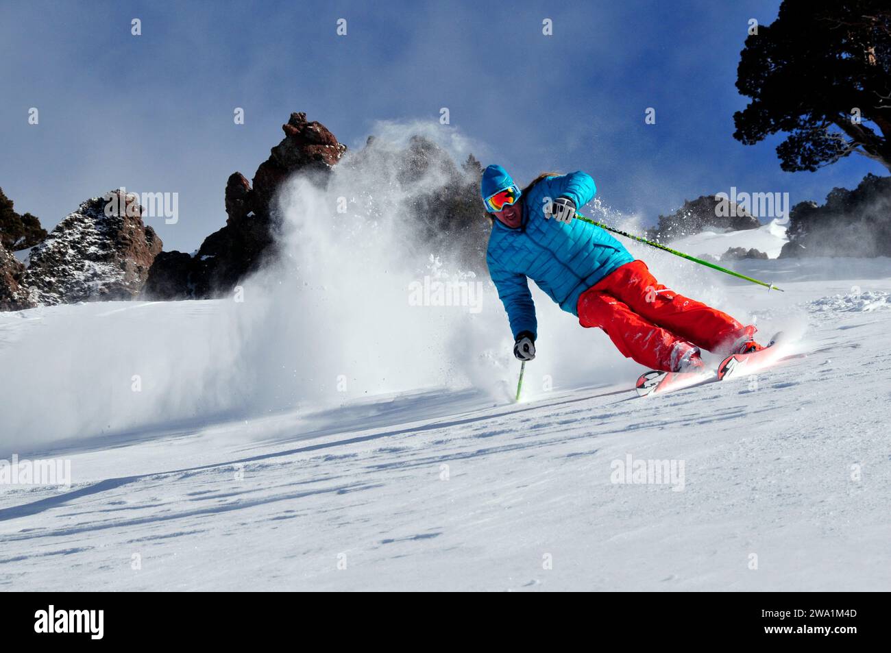 A man skiing on a blue bird powder day at a mountain resort near South Lake Tahoe, California. Stock Photo
