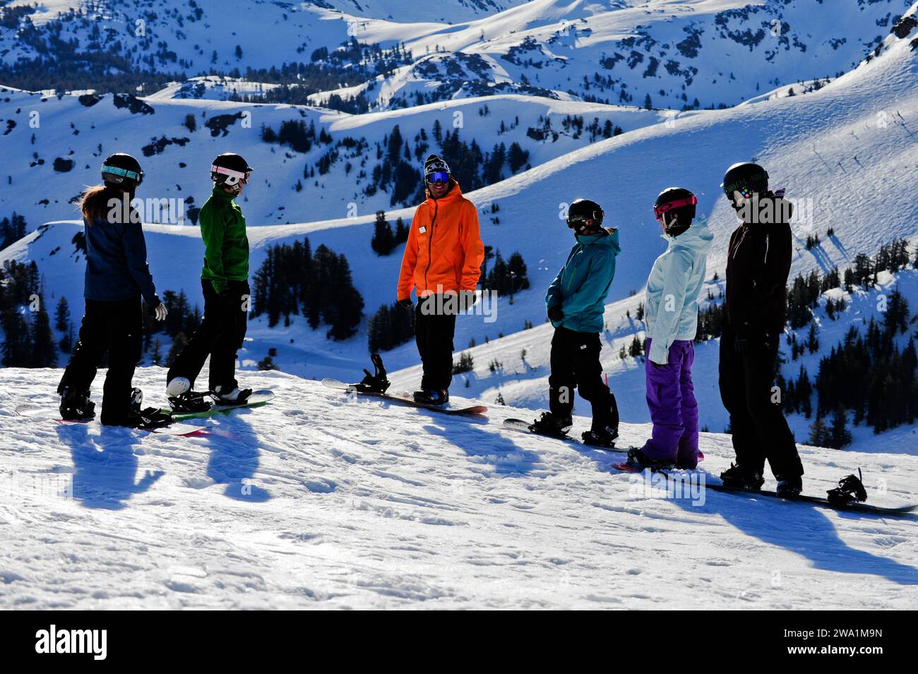 A snowboard instructor speaks to his students at Kirkwood Mountain