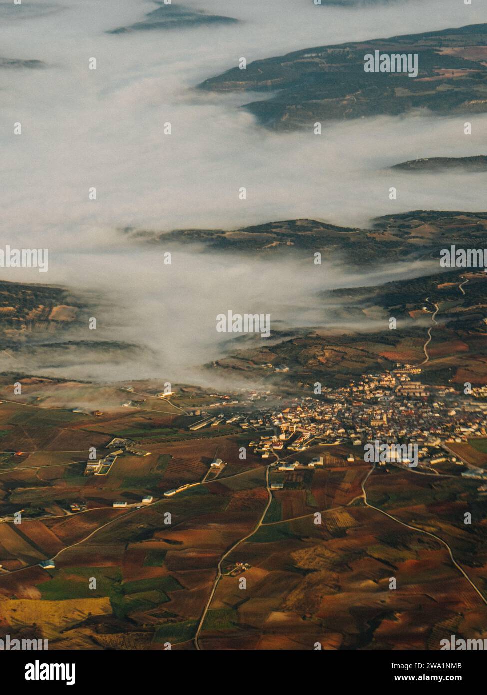 morning light on a Spanish town covered in fog Stock Photo Alamy