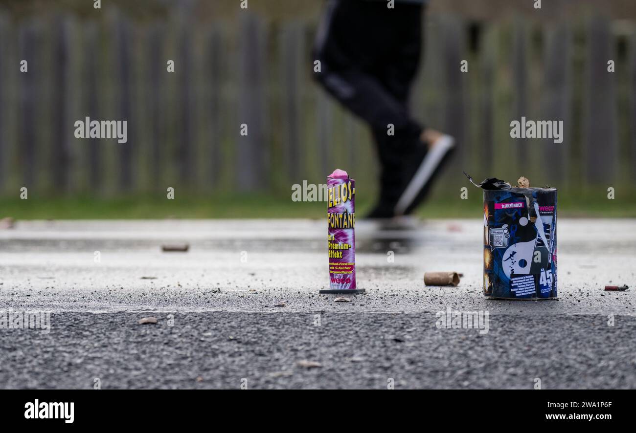 Gleusdorf, Germany. 01st Jan, 2024. The remains of burnt down firemen's bodies stand on the wet road in Gleusdorf, Lower Franconia (Haßberge district), while a man walks past them on New Year's morning. Credit: Pia Bayer/dpa/Alamy Live News Stock Photo