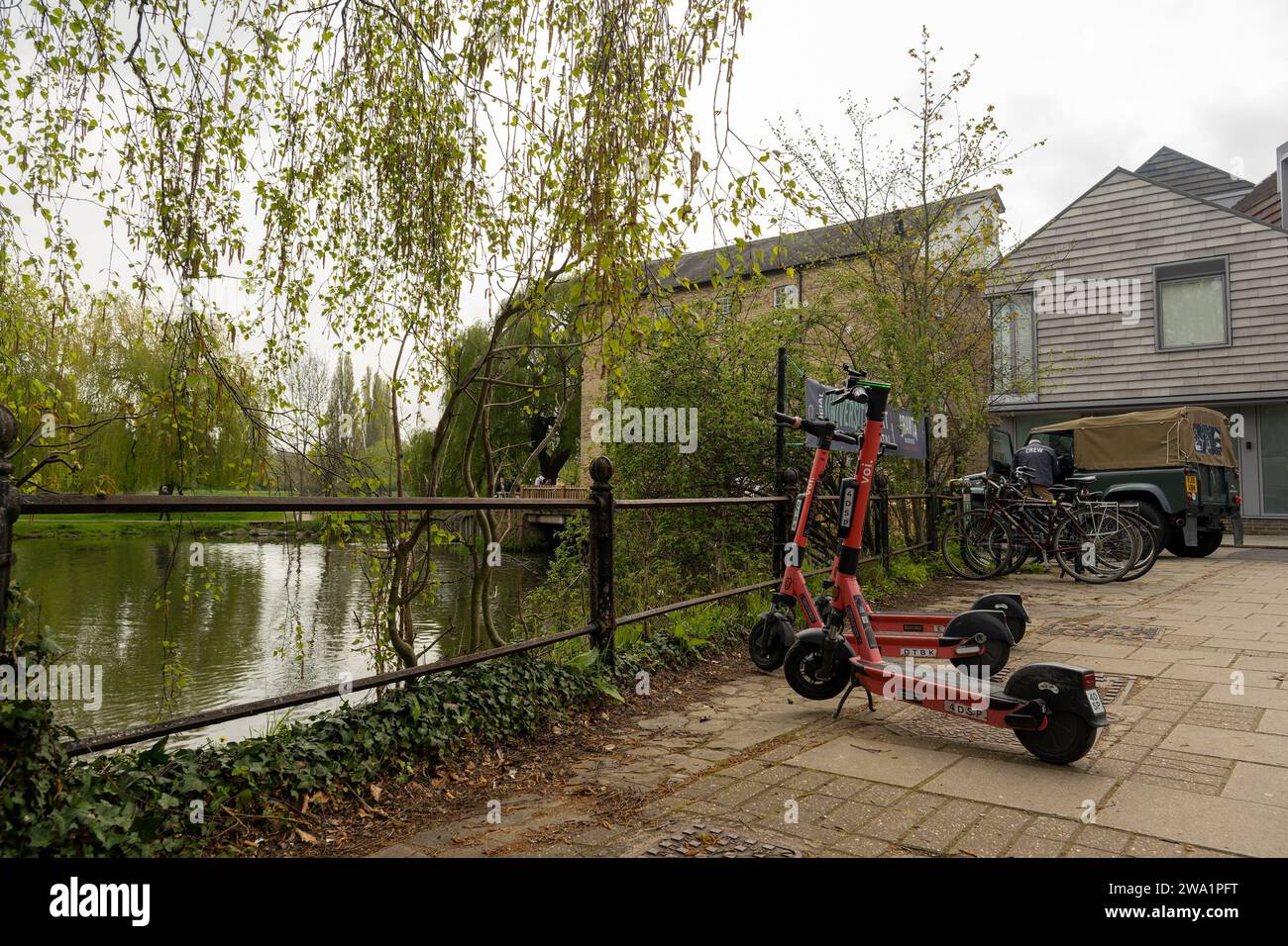 Two voi electric scooters parked by Mill Pond, Cambridge, Cambridgeshire, April 2023. Stock Photo