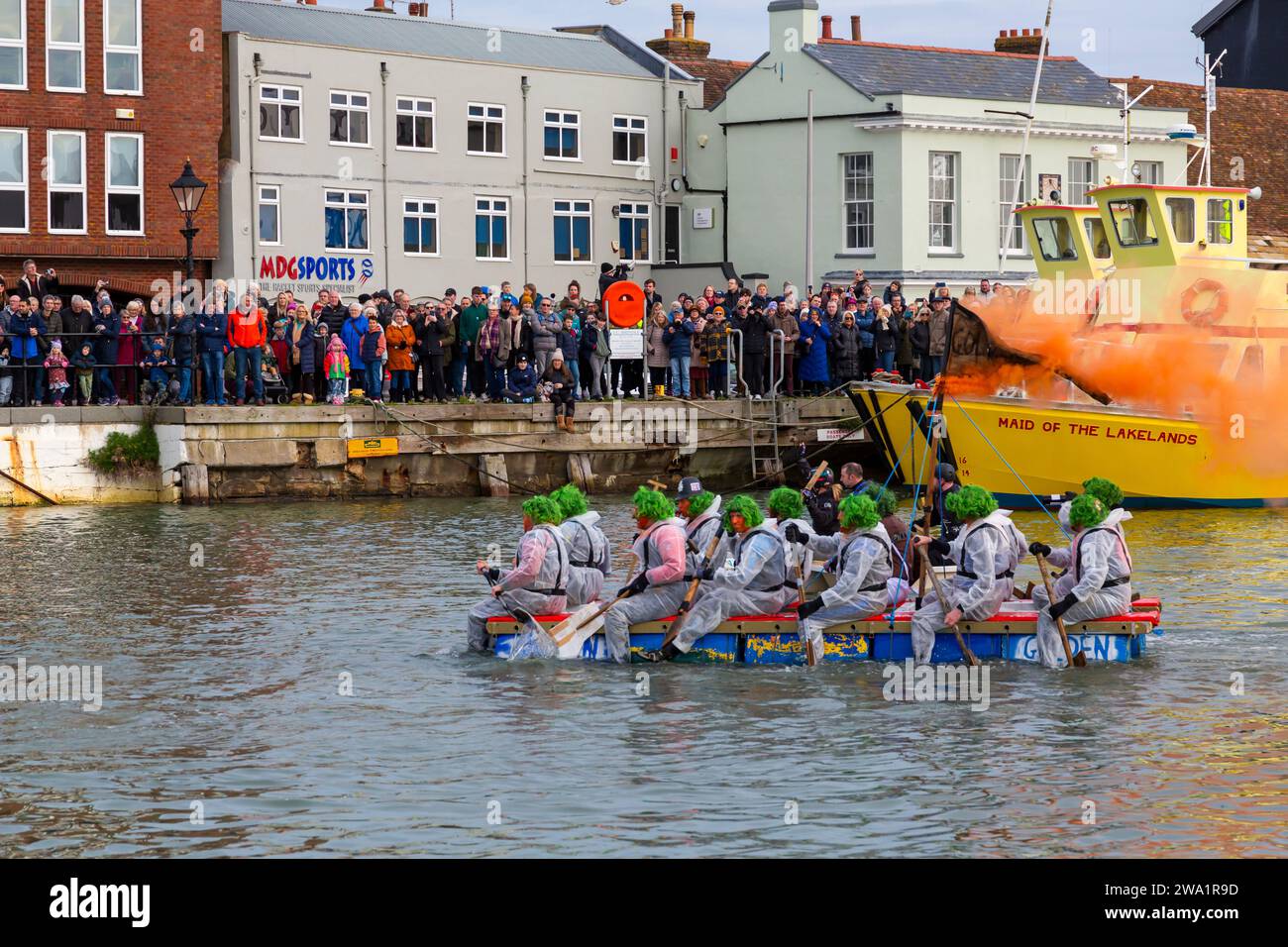 Poole, Dorset, UK. 1st January, 2024. The New Years Day Bath Tub Race takes place with plenty of thrill, spills and sabotage! Thousands turn out to watch the event, as a variety of unusual home made crafts take to the water to race, with participants having fun, throwing eggs and flour and capsizing competing craft. A feel good start to the New Year. Credit: Carolyn Jenkins/Alamy Live News Stock Photo