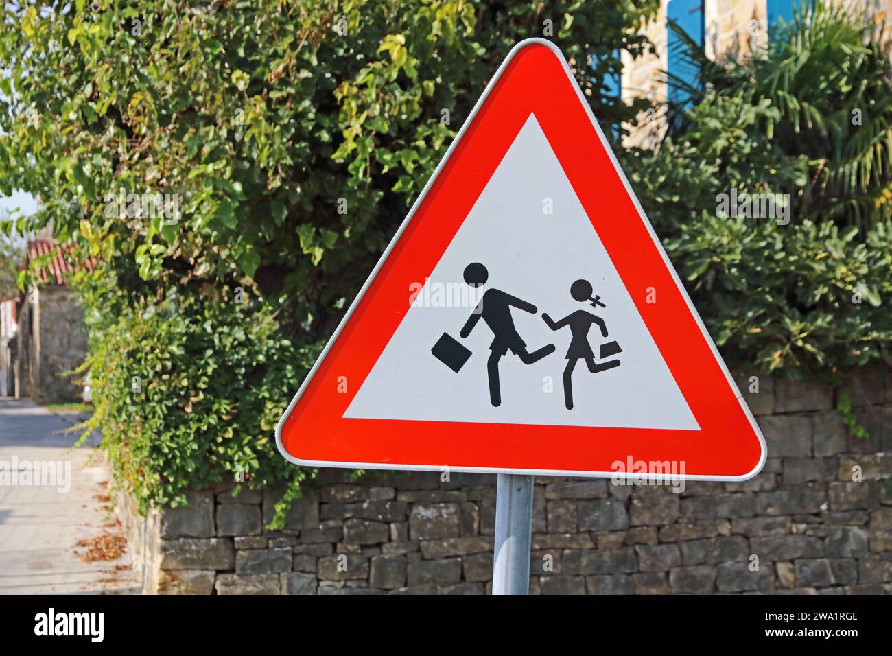 Attention, children crossing road sign Stock Photo