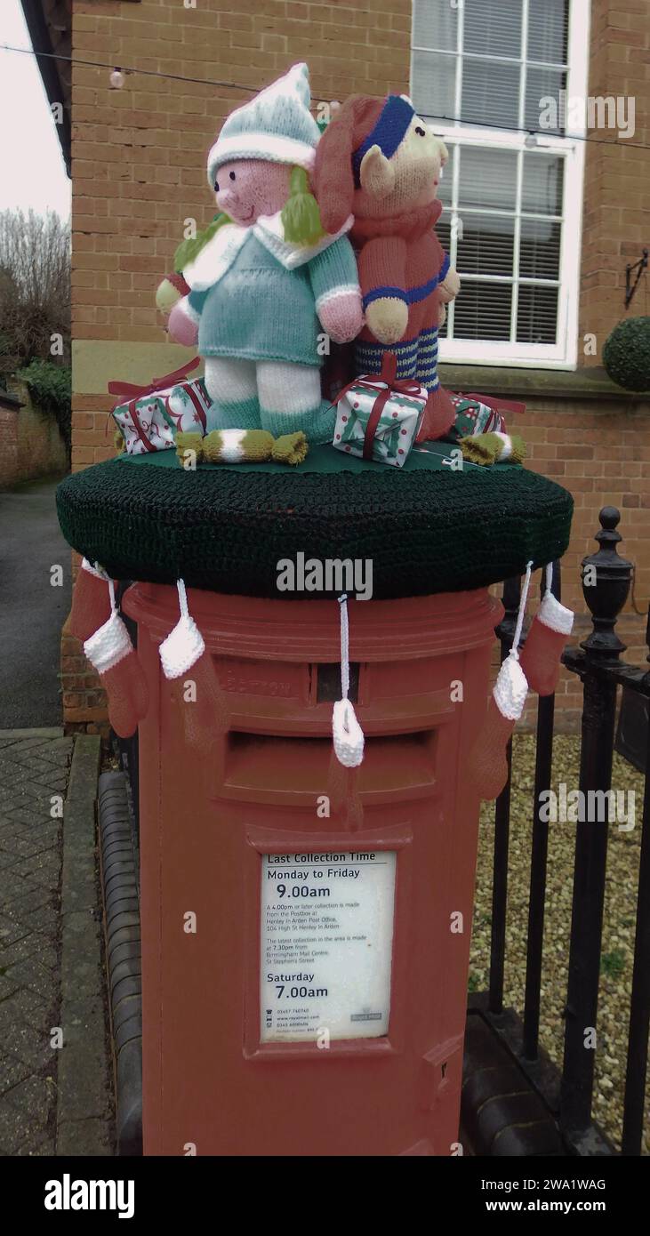 Christmas decorated letterboxes with knitted seasonal characters placed on top of letter boxes in Henley in Arden, Warwickshire, 2023 Stock Photo