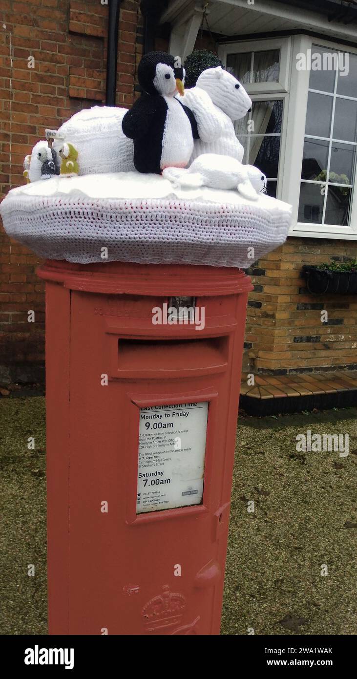 Christmas decorated letterboxes with knitted seasonal characters placed on top of letter boxes in Henley in Arden, Warwickshire, 2023 Stock Photo