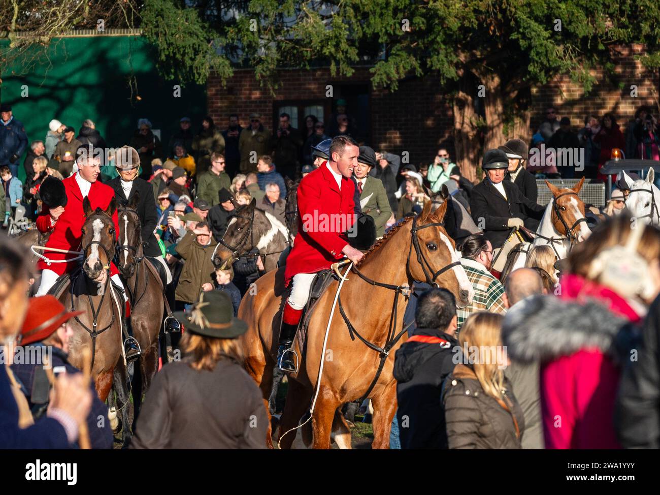 Melton Mowbrey January 1st 2024:  A large crowd gather in Play Close Park for the annual New Year’s Day hunt, this year, is the 41st time the town has hosted, riders and horses from the Cottesmore Hunt. Melton Mowbrey is located in the middle of three territories used for hunting The Quorn, The Belvoir and The Cottesmore on a rota basis, to hold the meet on New Year’s Day. The Rutland-based hunt set off on a ‘trail hunt’ around local fields, hounds follow the scent of a fox. Credit: Clifford Norton/Alamy Live News Stock Photo