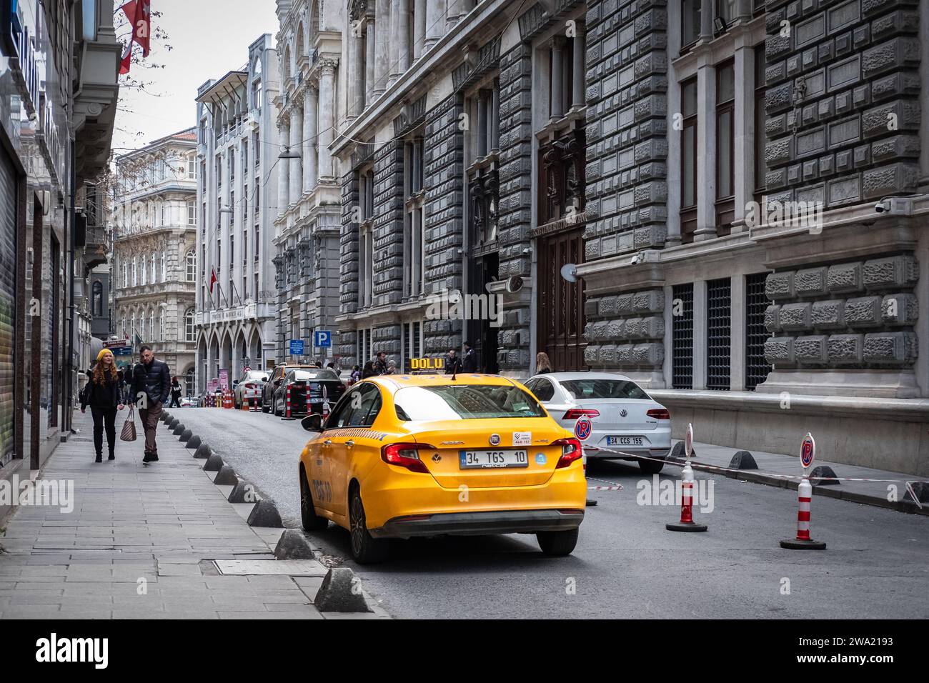 Yellow taxi, Istanbul Turkey. Yellow taxi with running engine wait client on residential area narrow street. Turkish taxi car on street. December 24,2 Stock Photo