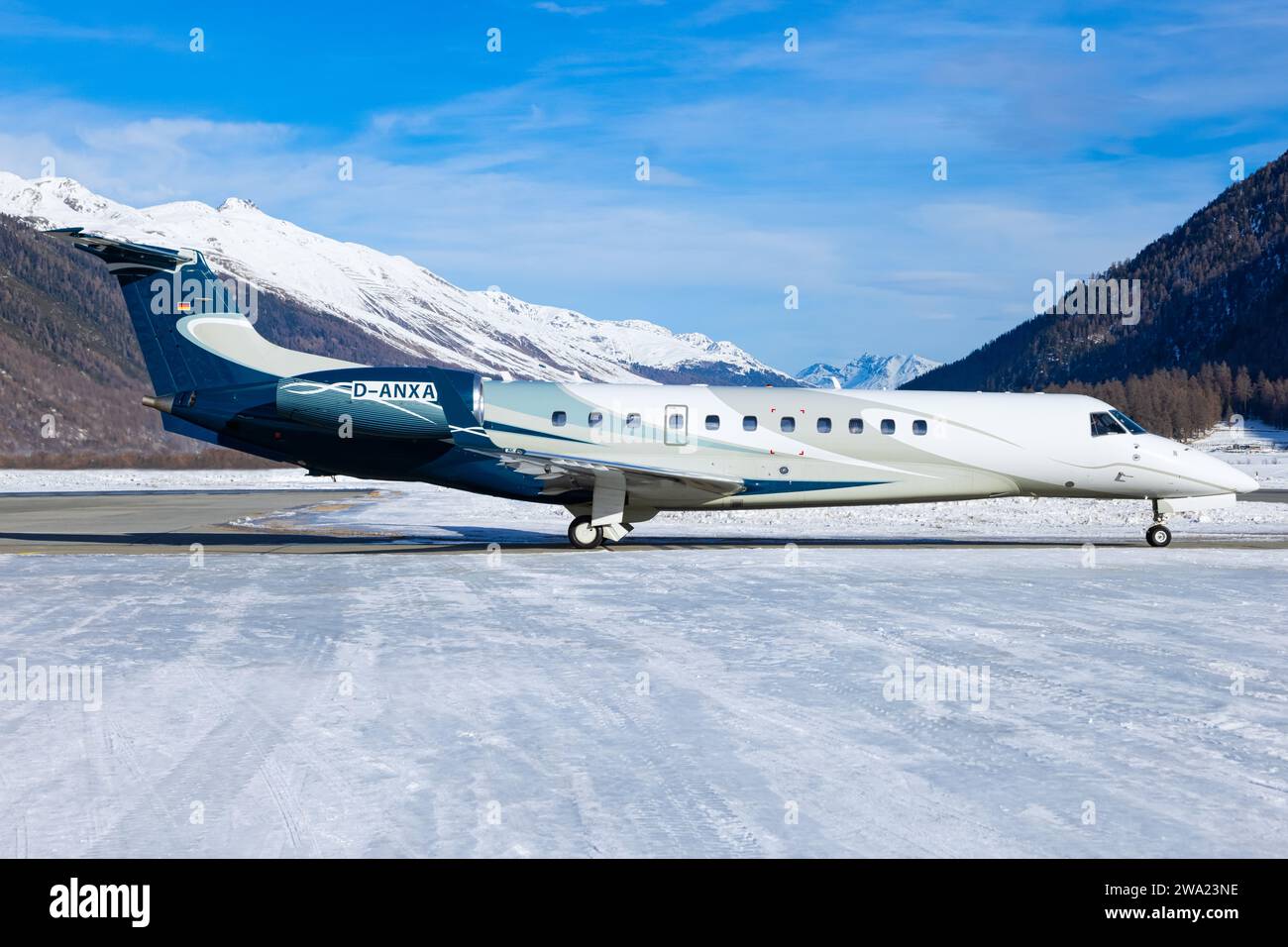 Samedan, Switzerland - OctoberFebruary 2021:Embraer 145 approaching cold snowy Stock Photo