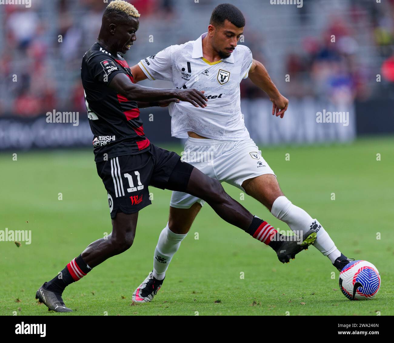 Sydney, Australia. 01st Jan, 2024. Valentino Yuel of the Wanderers competes for the ball with Ali Auglah of Macarthur during the A-League match between the Wanderers and Macarthur at CommBank Stadium on January 1, 2024 Credit: IOIO IMAGES/Alamy Live News Stock Photo