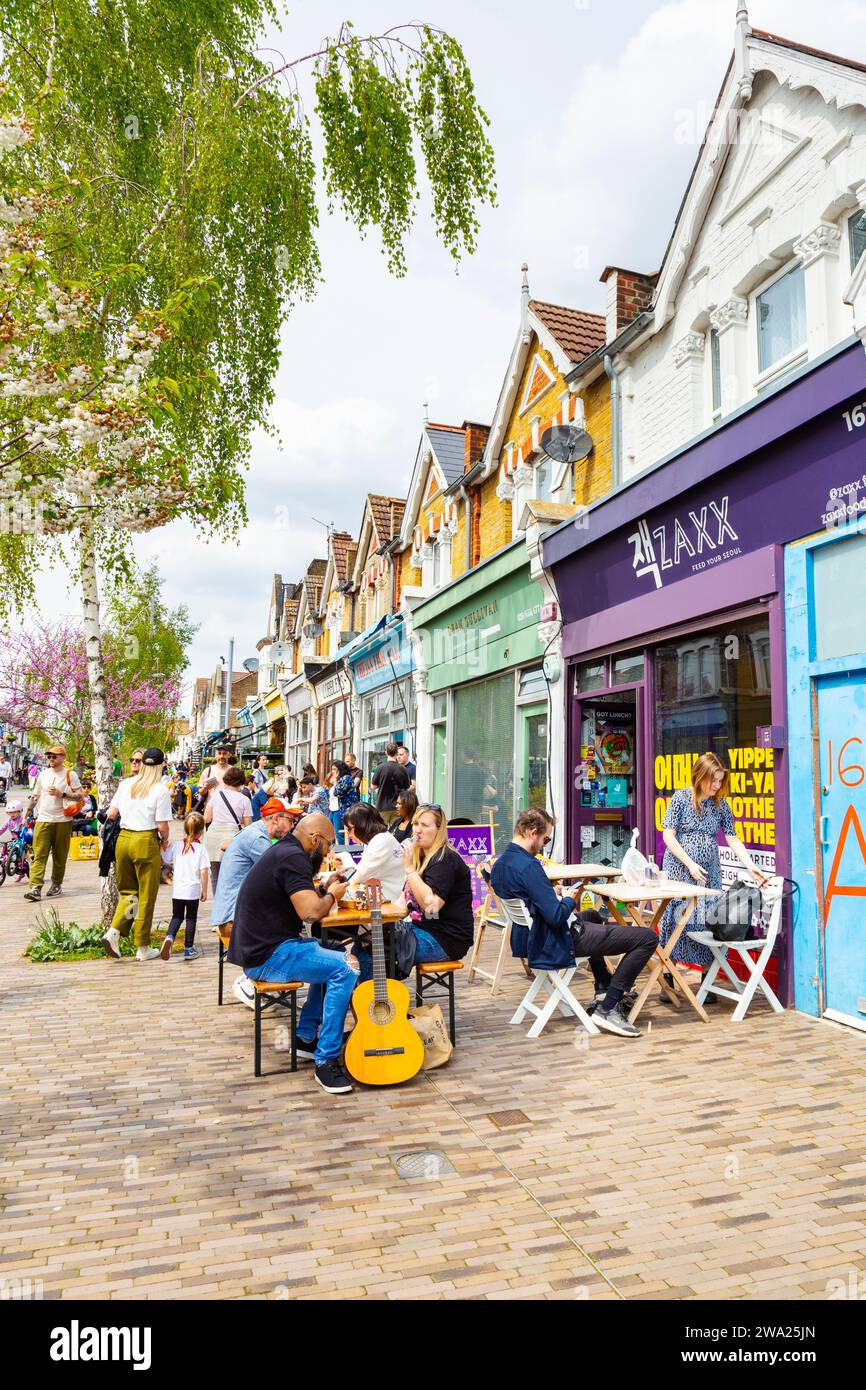 People sitting al fresco outside restaurants and cafes in Francis Road
