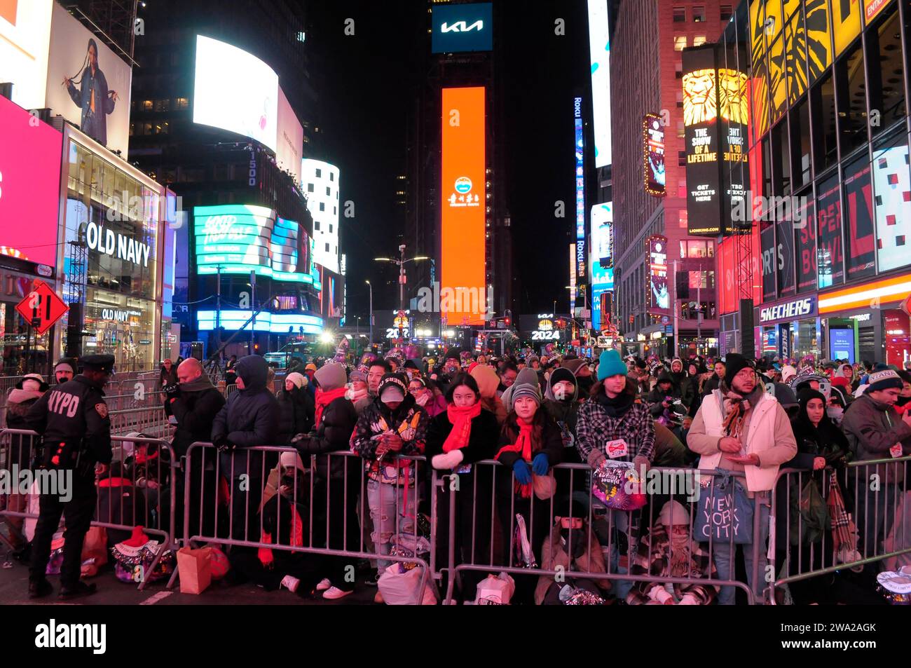 New York, United States. 31st Dec, 2023. A crowd of revelers, some