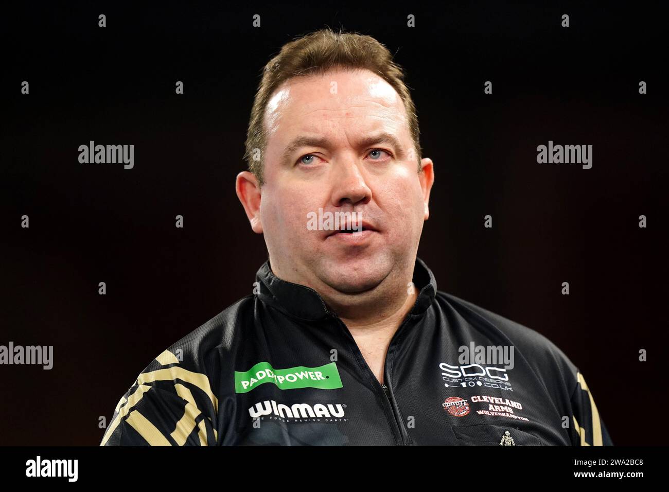 Brendan Dolan in action against Luke Littler (not pictured) on day