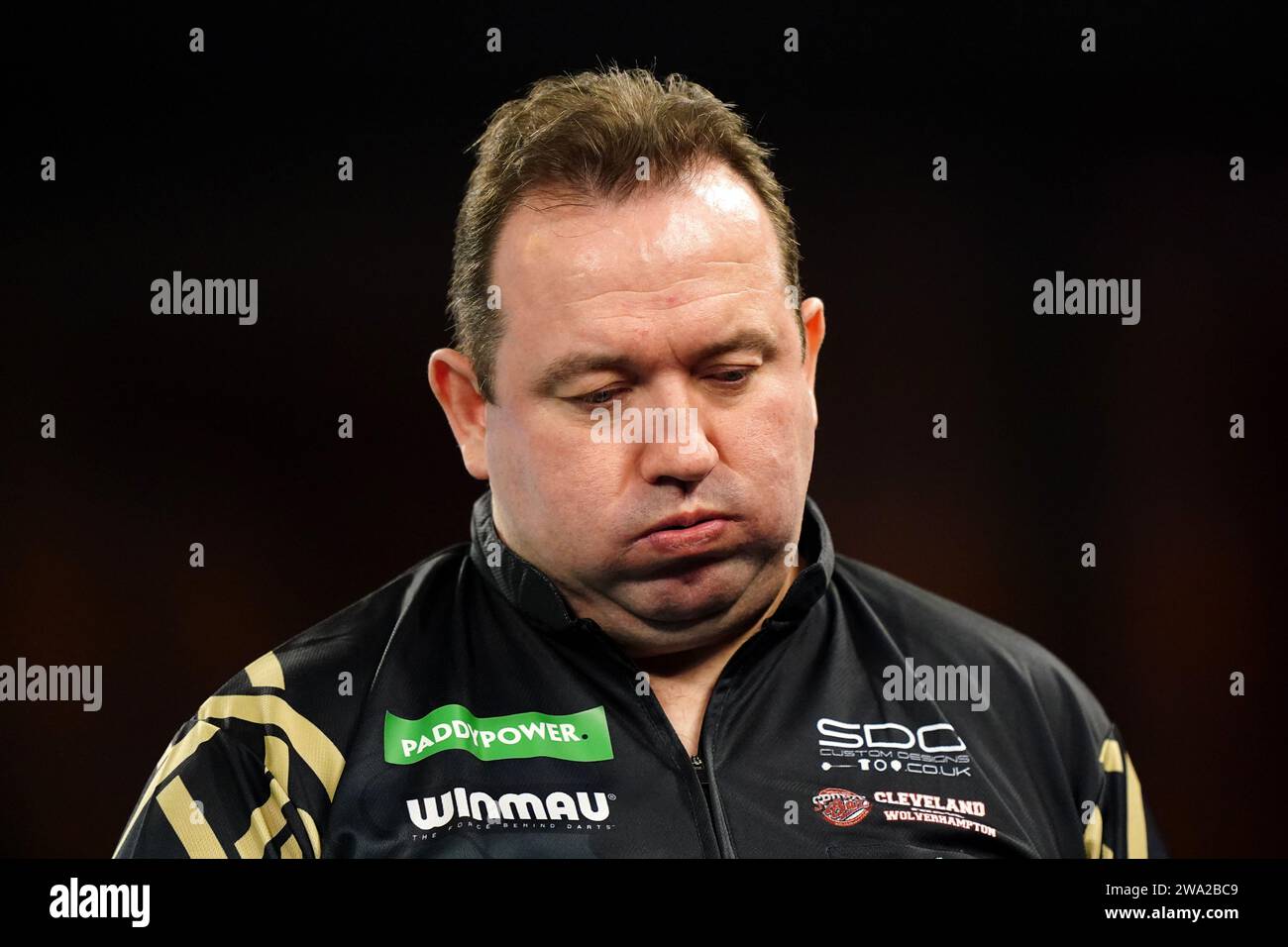 Brendan Dolan in action against Luke Littler (not pictured) on day fourteen of the Paddy Power
