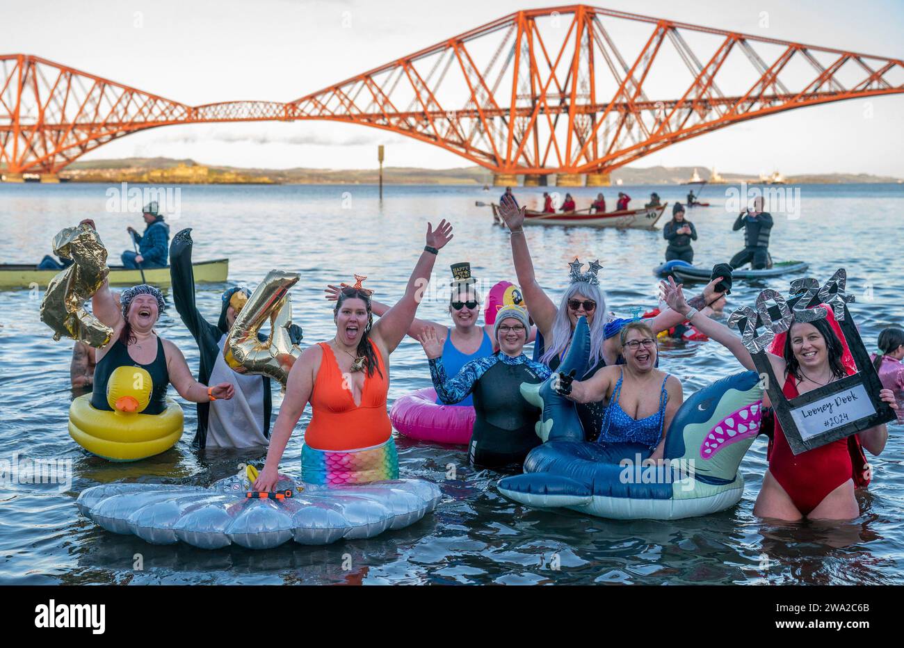 People take part in the Loony Dook New Year's Day dip in the Firth of