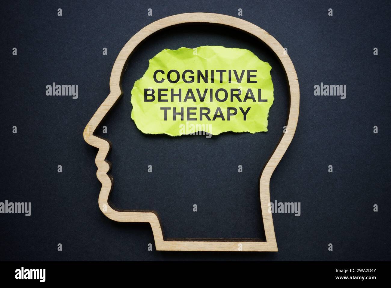 Outline of the head and inscription Cognitive behavioral therapy CBT on a piece of paper. Stock Photo