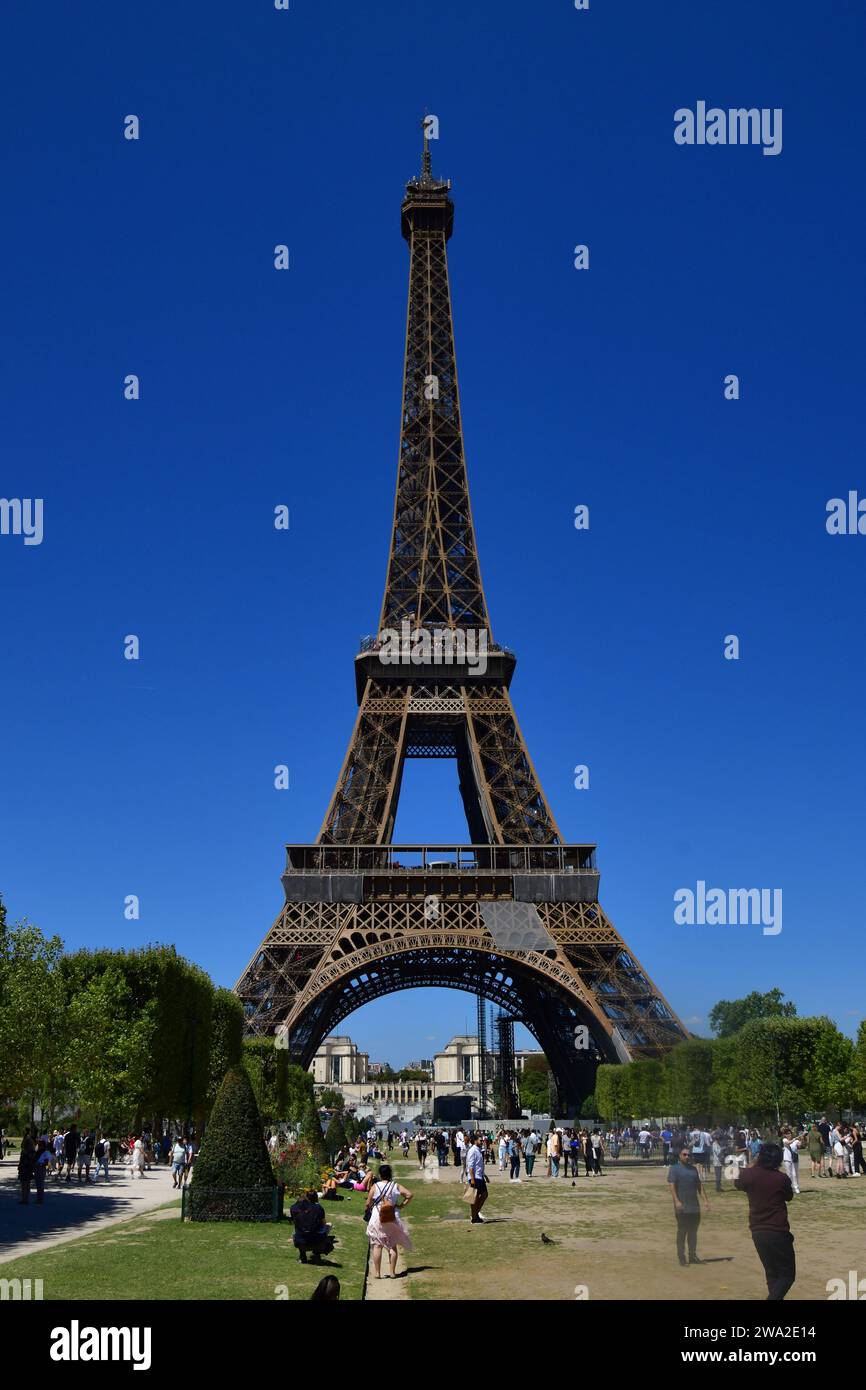 Eiffel tower with the green park in the foreground, on a sunny August day. Stock Photo