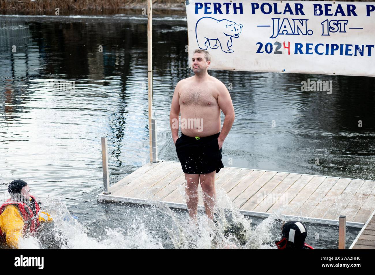 Perth, Canada. 01st Jan, 2024. A Polar Bear plunger rings in the New