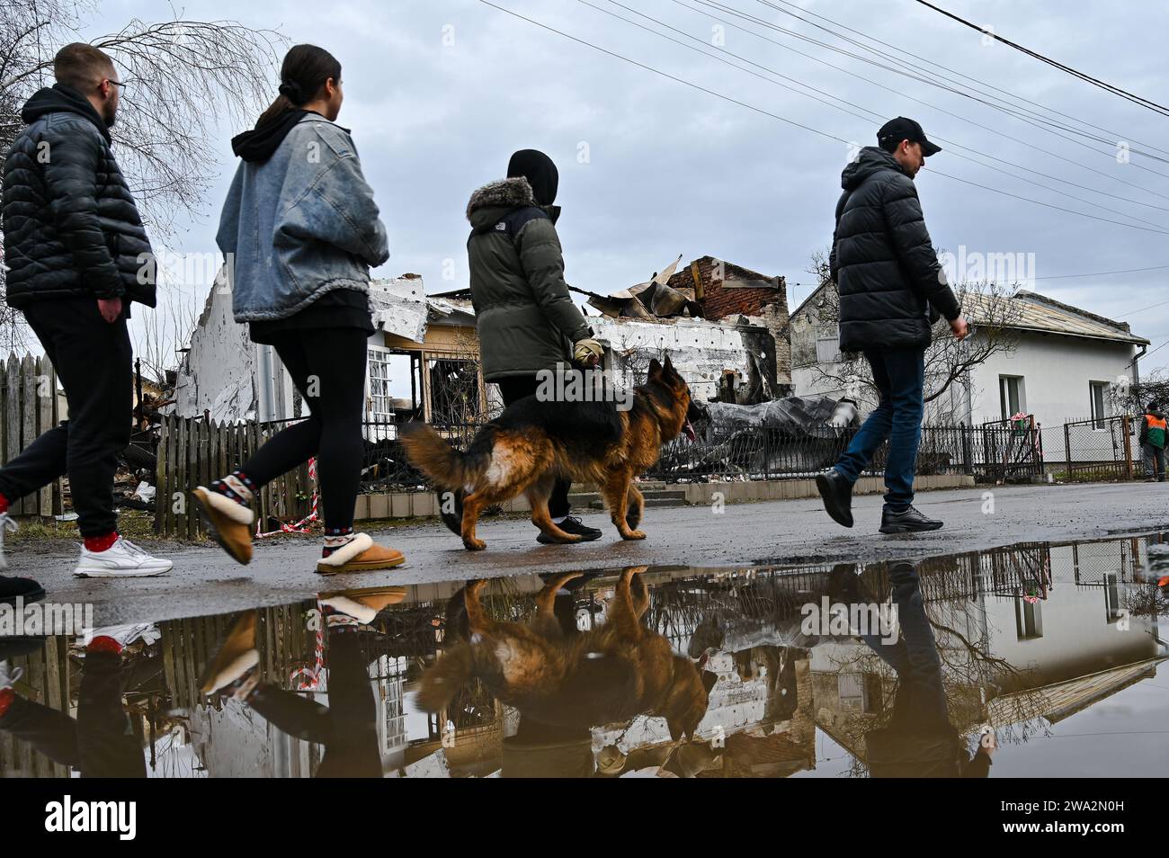 Non Exclusive: LVIV, UKRAINE - JANUARY 1, 2024 - Members of the public walk past the fire-stricken museum of Roman Shukhevych, the military leader of Stock Photo