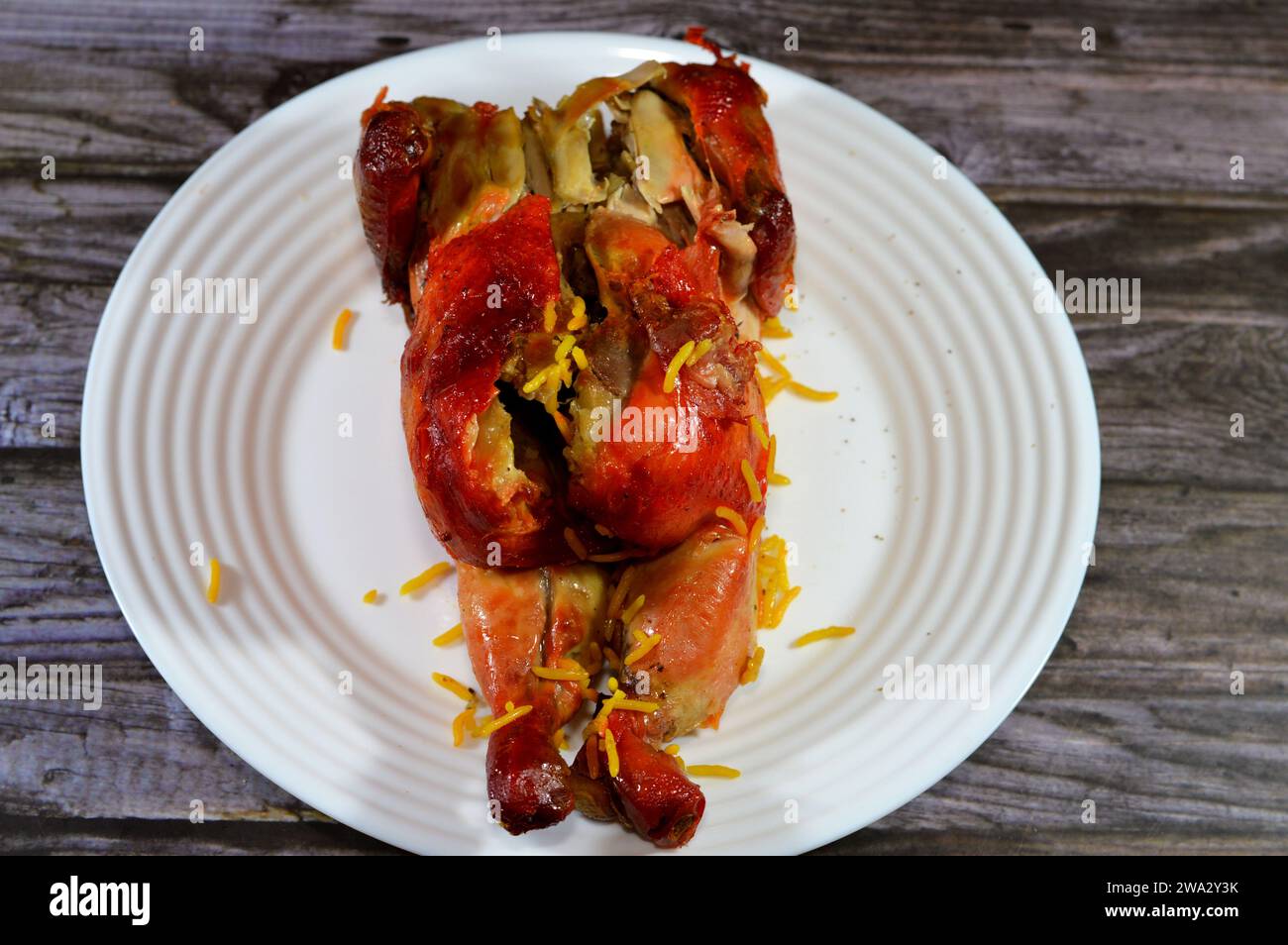 Gulf cuisine of Mandi cooked chicken, a whole chicken made in a Mandi