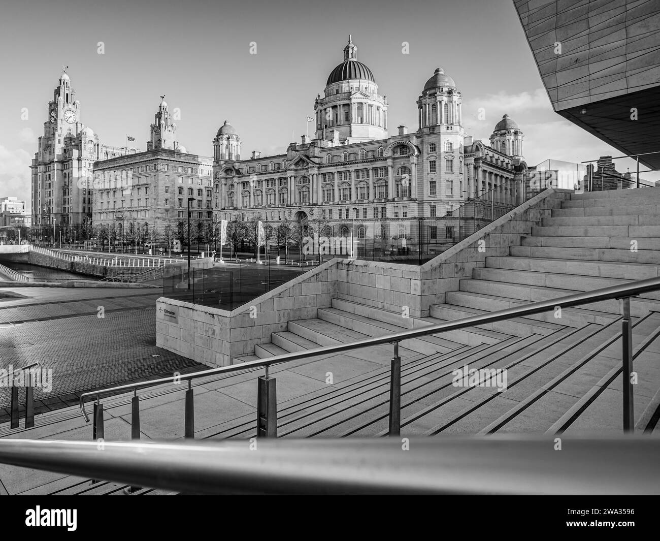 A black and white image of the Three Graces on the Liverpool waterfront seen on 1 January 2024. Stock Photo