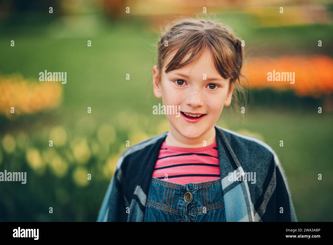 Summer portrait of young happy kid girl wearing denim overalls Stock ...