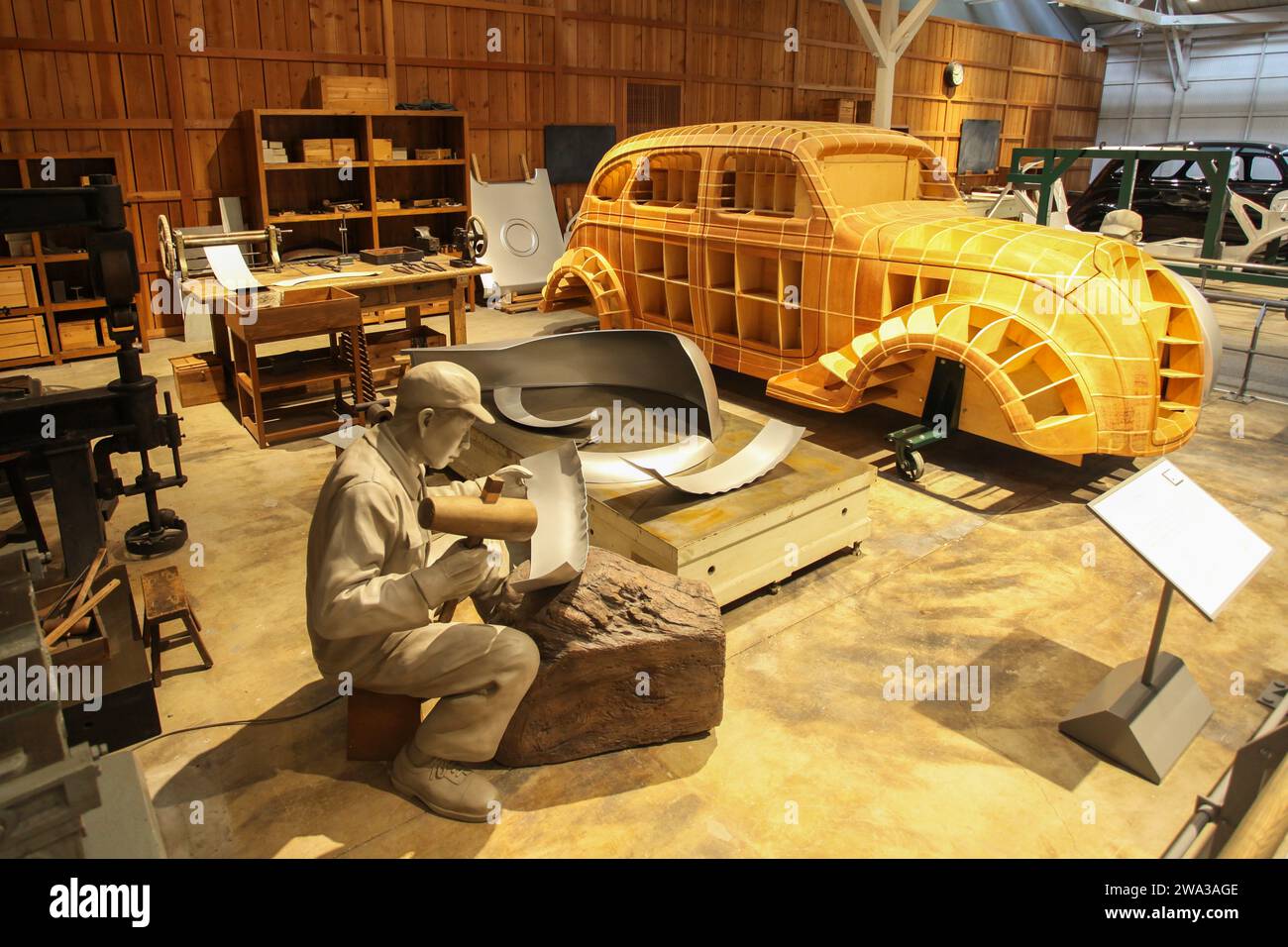 Inside the Toyota Commemorative Museum of Industry and Technology with a display showing making of the Toyota AA model by hand. Stock Photo