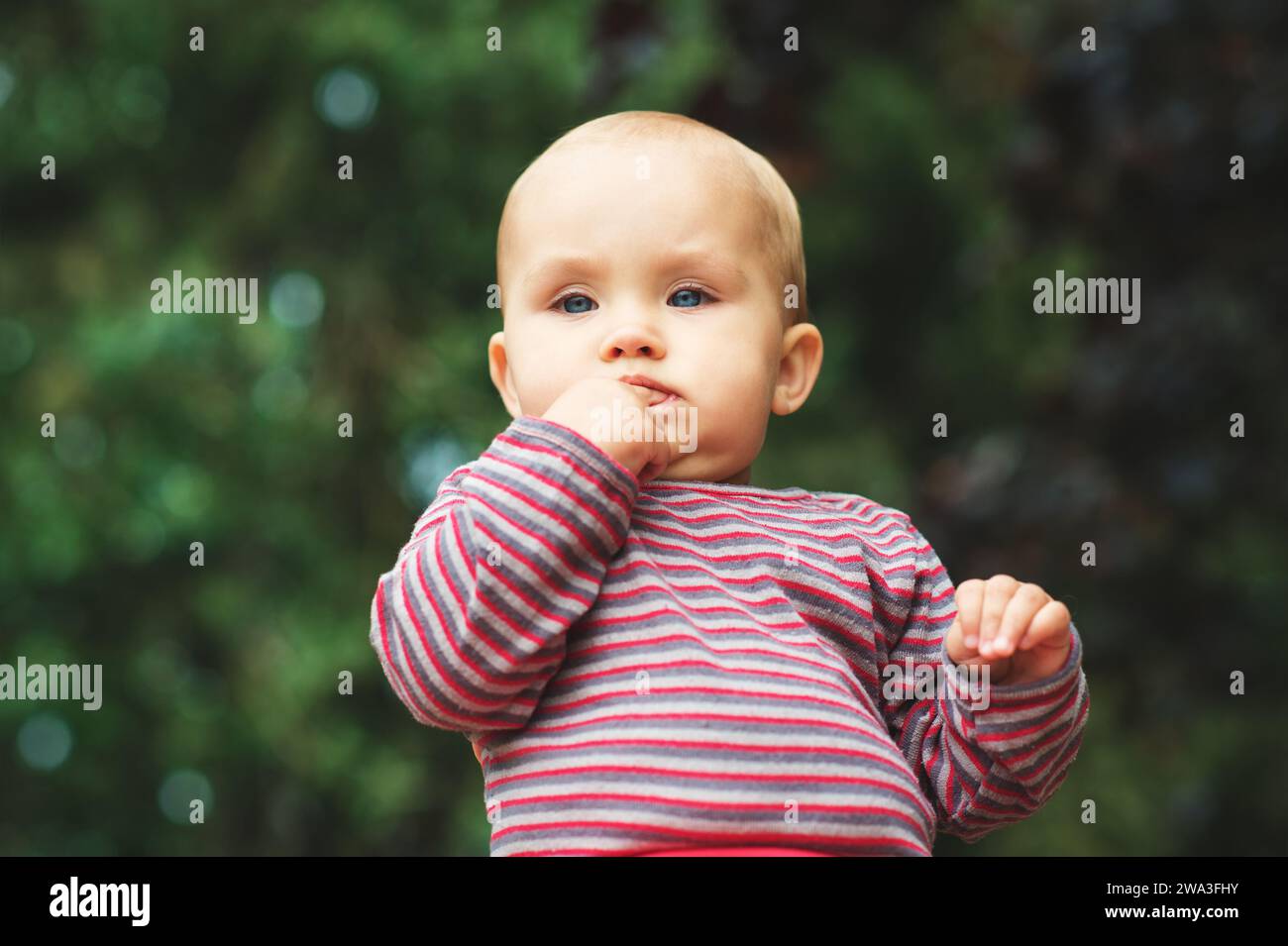 Outdoor close up portrait of cute little baby girl Stock Photo
