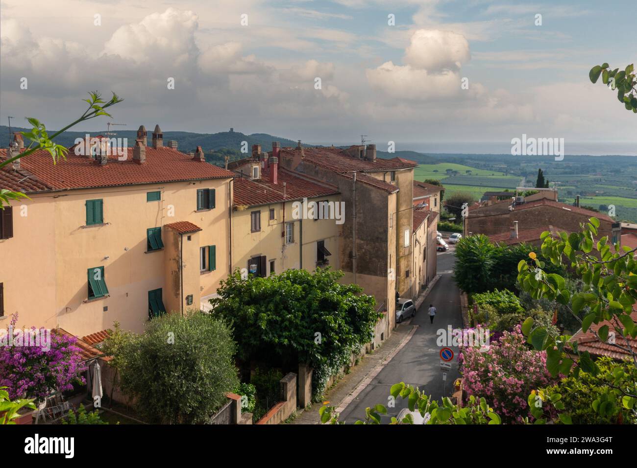 Elevated view of Via Antonio Gramsci street of the medieval village with the Etruscan coast in the background in summer, Castagneto Carducci, Tuscany Stock Photo