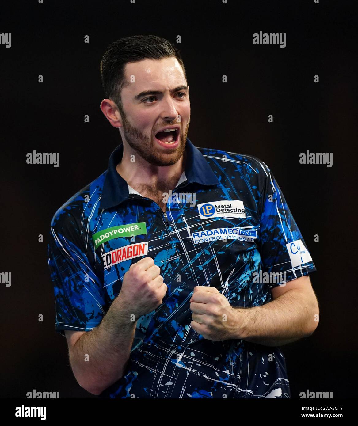Luke Humphries celebrates victory over Dave Chisnall (not pictured) on