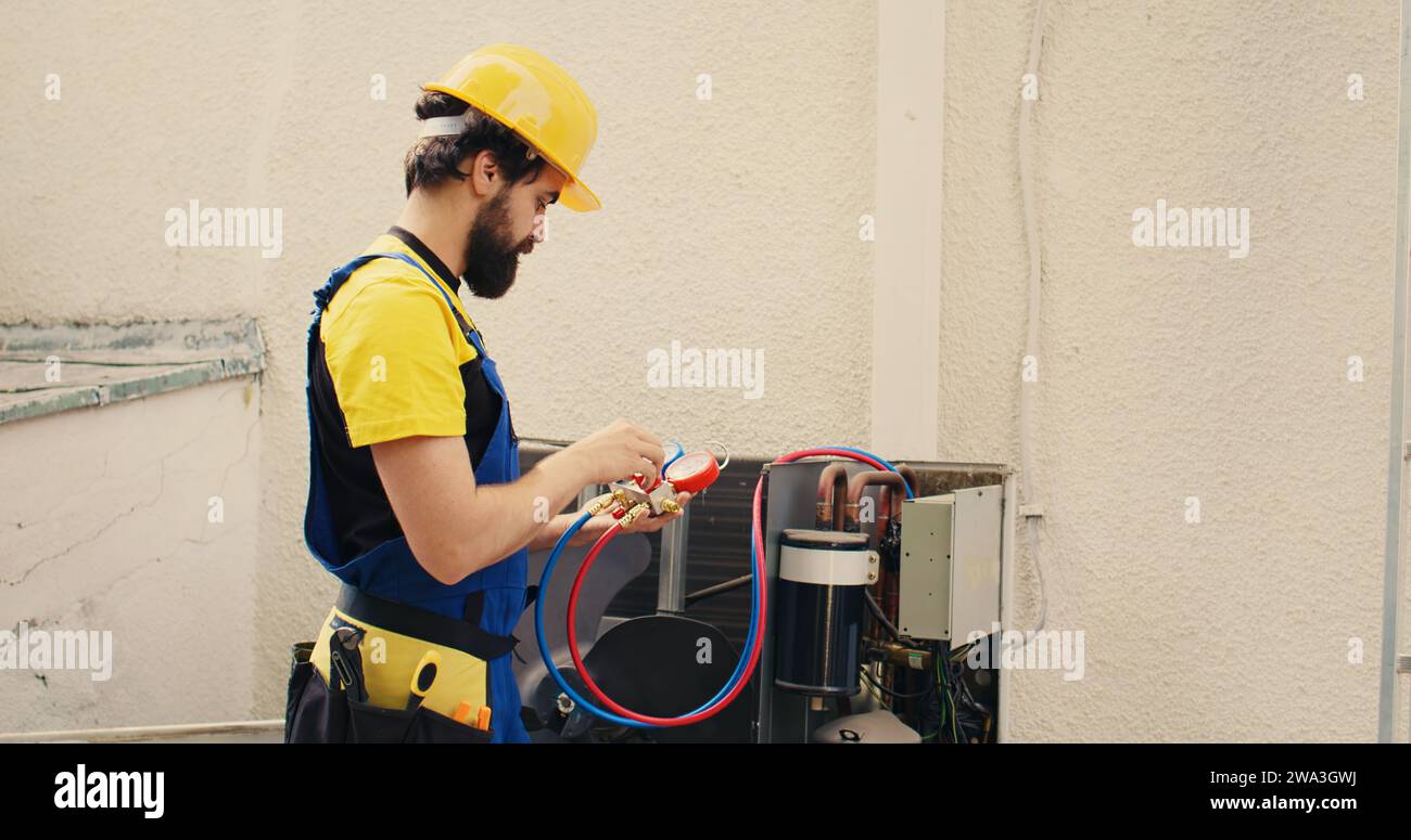 Adept repairman calibrating pressure measurement device during