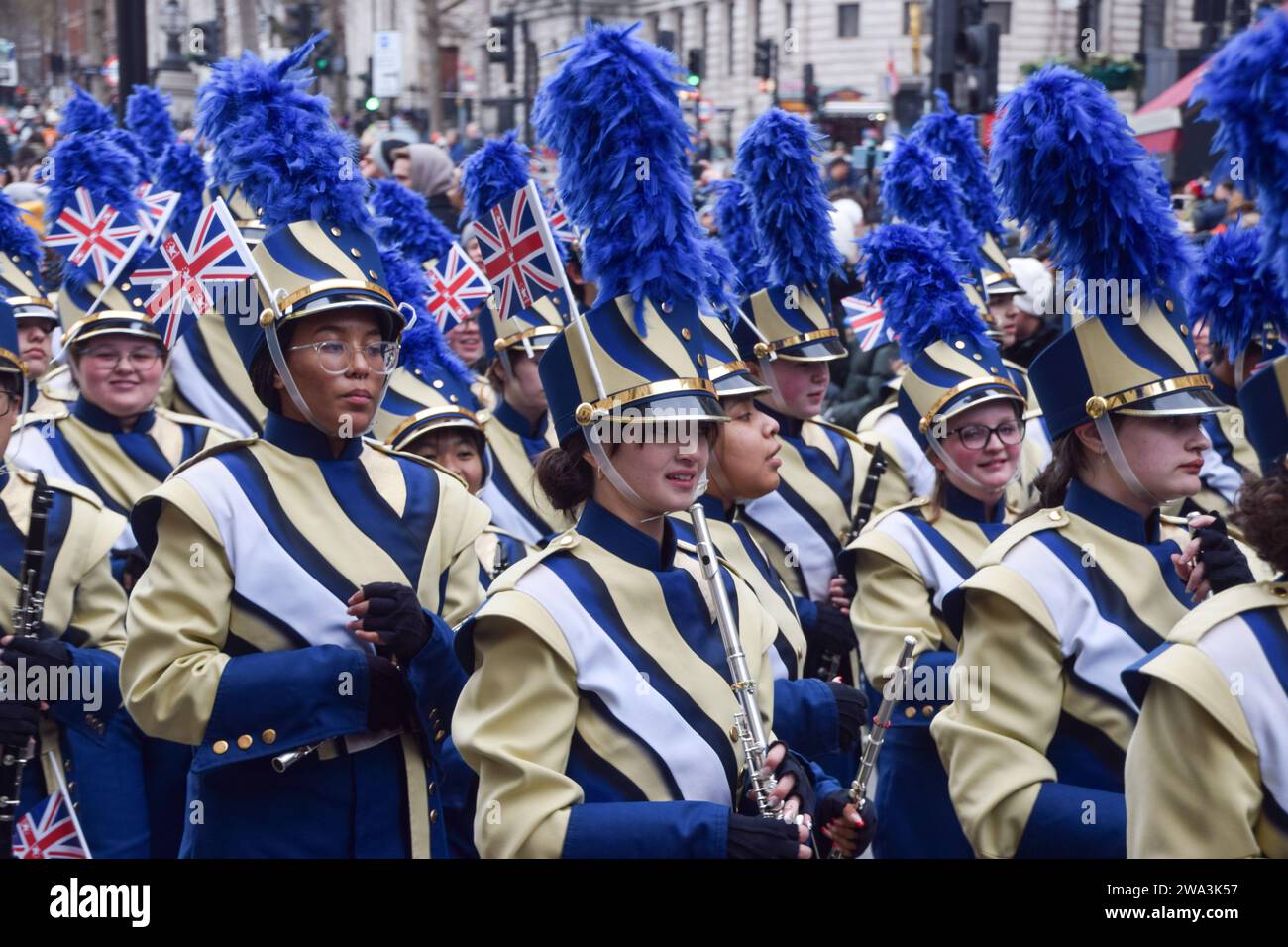 London, UK. 1st January 2024. A marching band passes through Trafalgar Square during London's