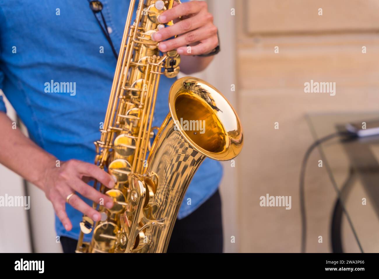 Detail of hands of jazz musician playing saxophone, Jazz mood Concept Stock Photo