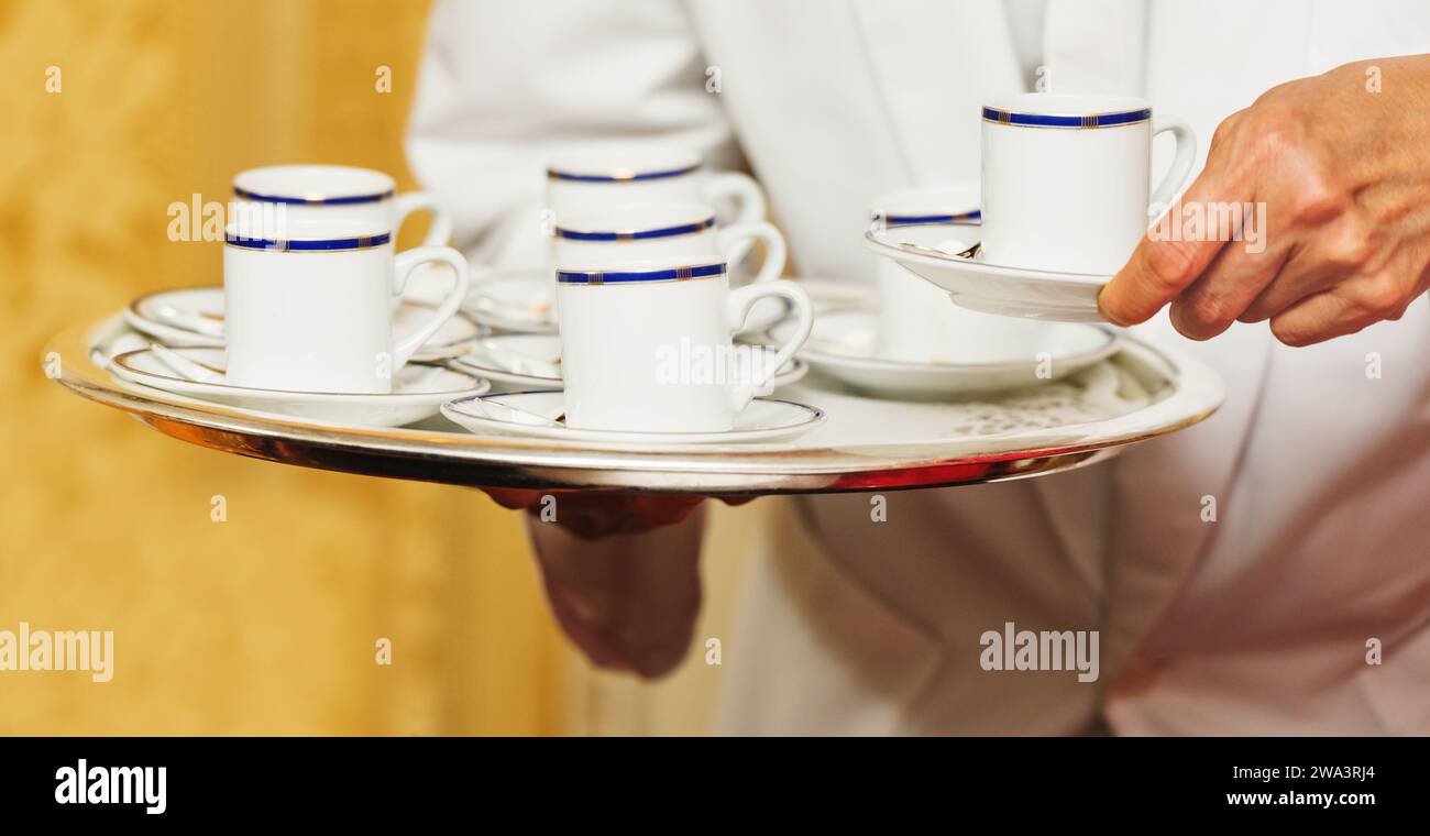 Waiter carrying tray hi-res stock photography and images - Alamy