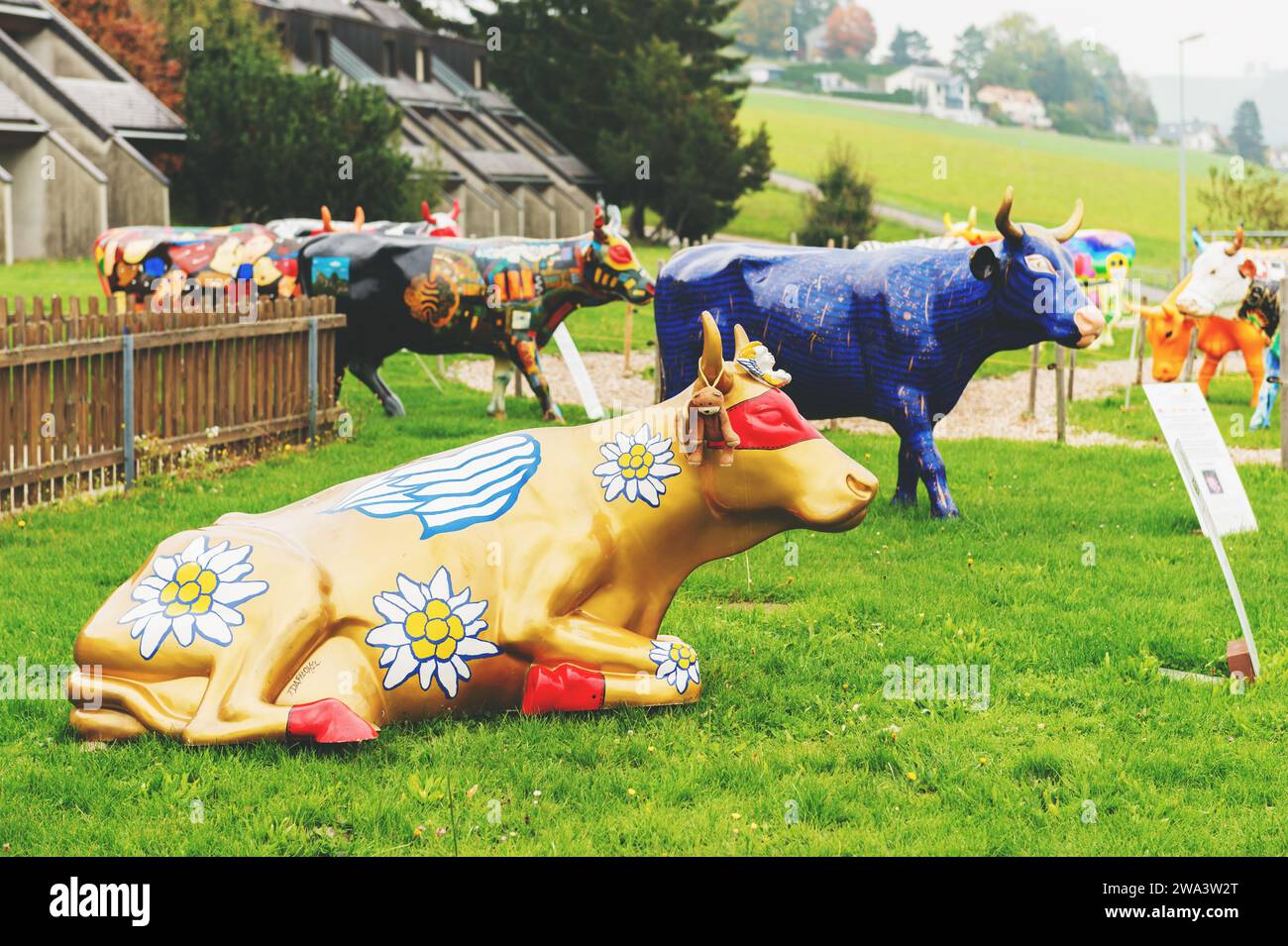 GRUYERE, SWITZERLAND - APRIL 29, 2014: swiss Restoroute Motel de la Gruyère presenting exposition with Poya cows decorated by local artists Stock Photo