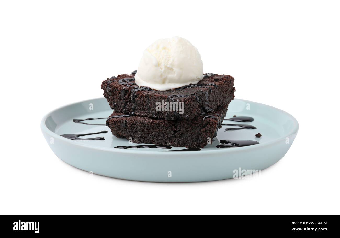 Tasty brownies with ice cream and chocolate sauce isolated on white ...