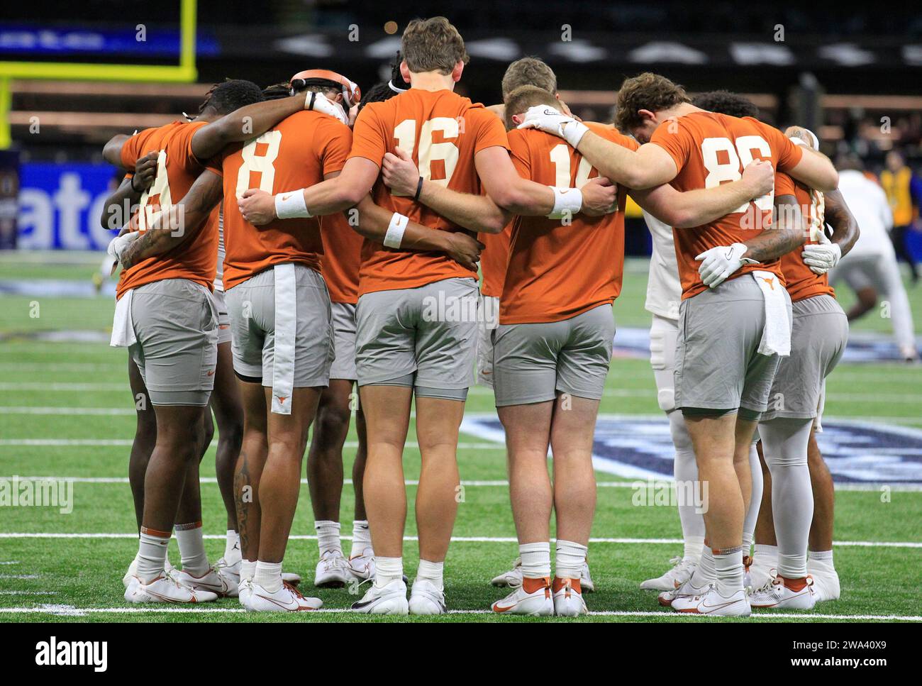 New Orleans, United States. 01st Jan, 2024. Texas Longhorn players huddle before the 2024 Sugar Bowl NCAA football game against the Washington Huskies at Caesars Superdome in New Orleans, Louisiana on Monday, January 1, 2024. Photo by AJ Sisco/UPI Credit: UPI/Alamy Live News Stock Photo