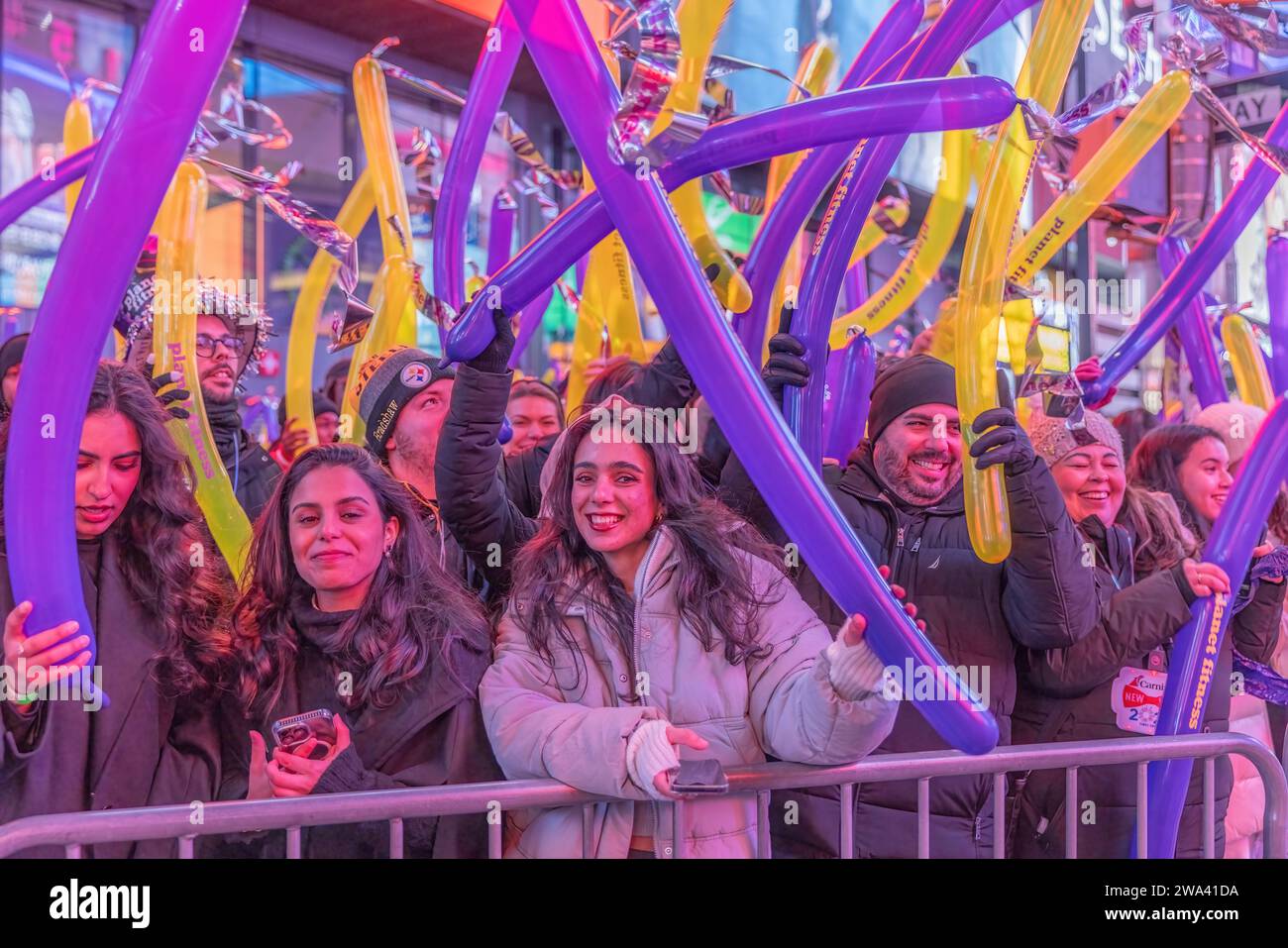 NEW YORK, N.Y. – December 31, 2023: New Year’s Eve revelers gather in Times Square. Stock Photo