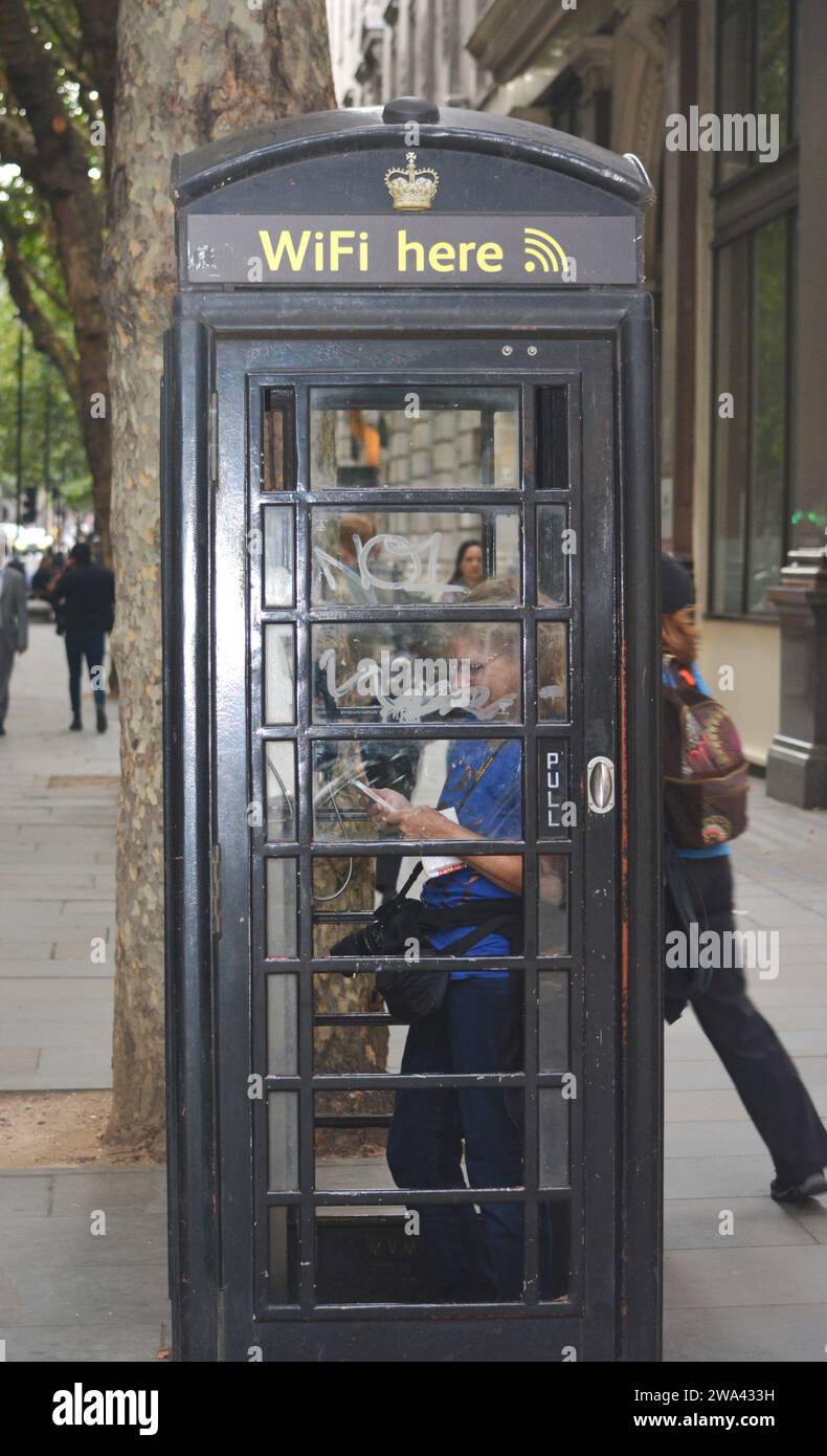 Old phone booth turned into WiFi hotspot. Stock Photo