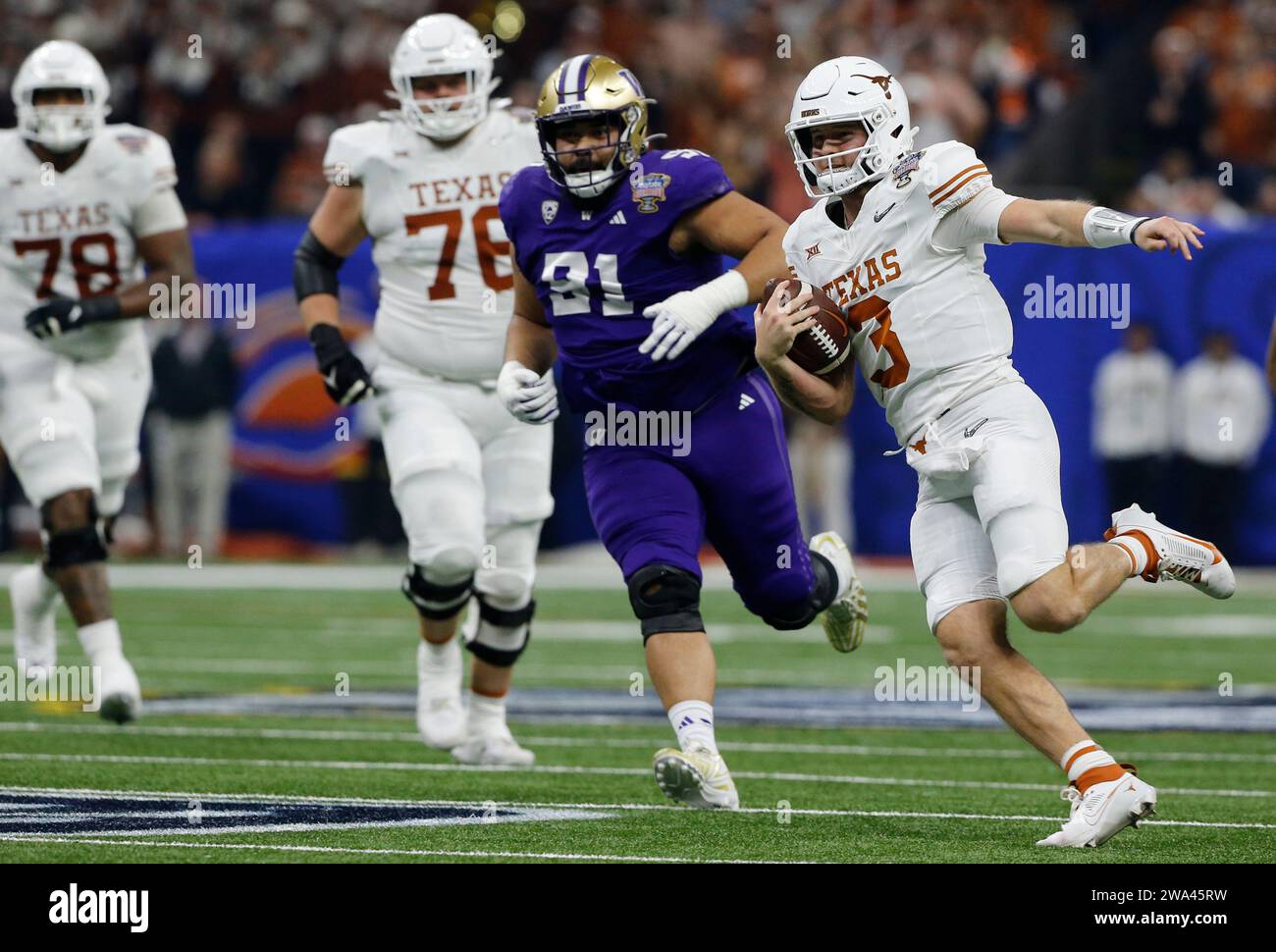 New Orleans, United States. 02nd Jan, 2024. Texas Longhorns quarterback Quinn Ewers runs for a first down in the first quarter against the Washington Huskies at Caesars Superdome in New Orleans, Louisiana on Monday, January 1, 2024. Photo by AJ Sisco/UPI Credit: UPI/Alamy Live News Stock Photo